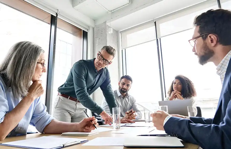 Legal team discussing a business law case around a conference table